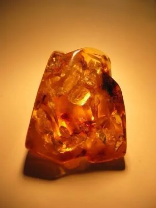 Black sunstone displaying aventurescence effect under light