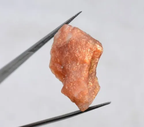 Microscopic view of hematite inclusions in sunstone